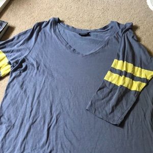 Torrid shirt size 2 yellow stripes on arm.
